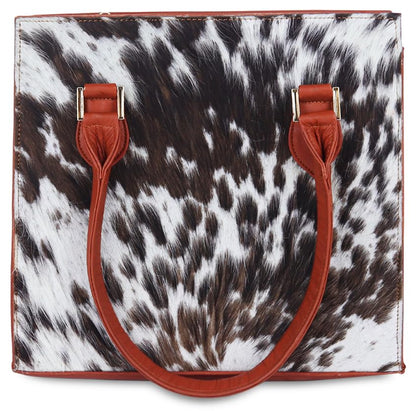 Cow print top handle handbag for women in premium quality.