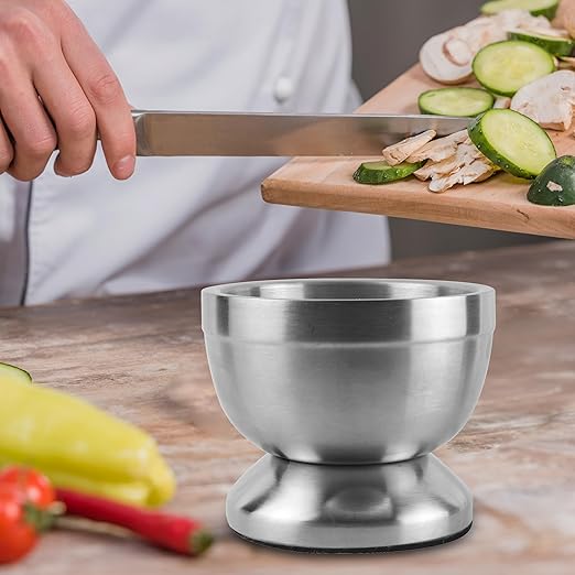 9-ounce stainless steel mortar and pestle with lid.